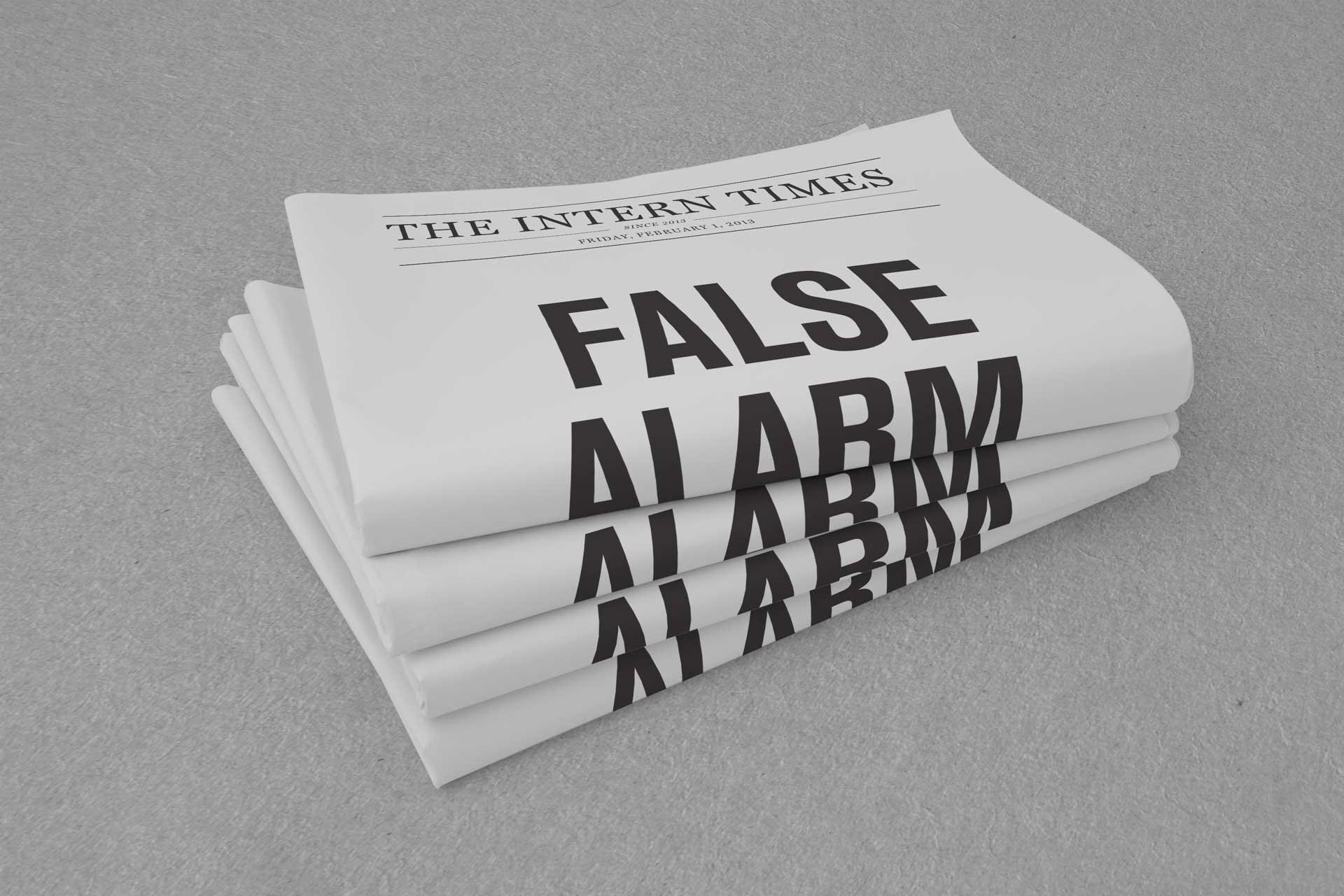 A stack of folded newspapers on grey, the masthead The Intern Times above the headline FALSE ALARM.