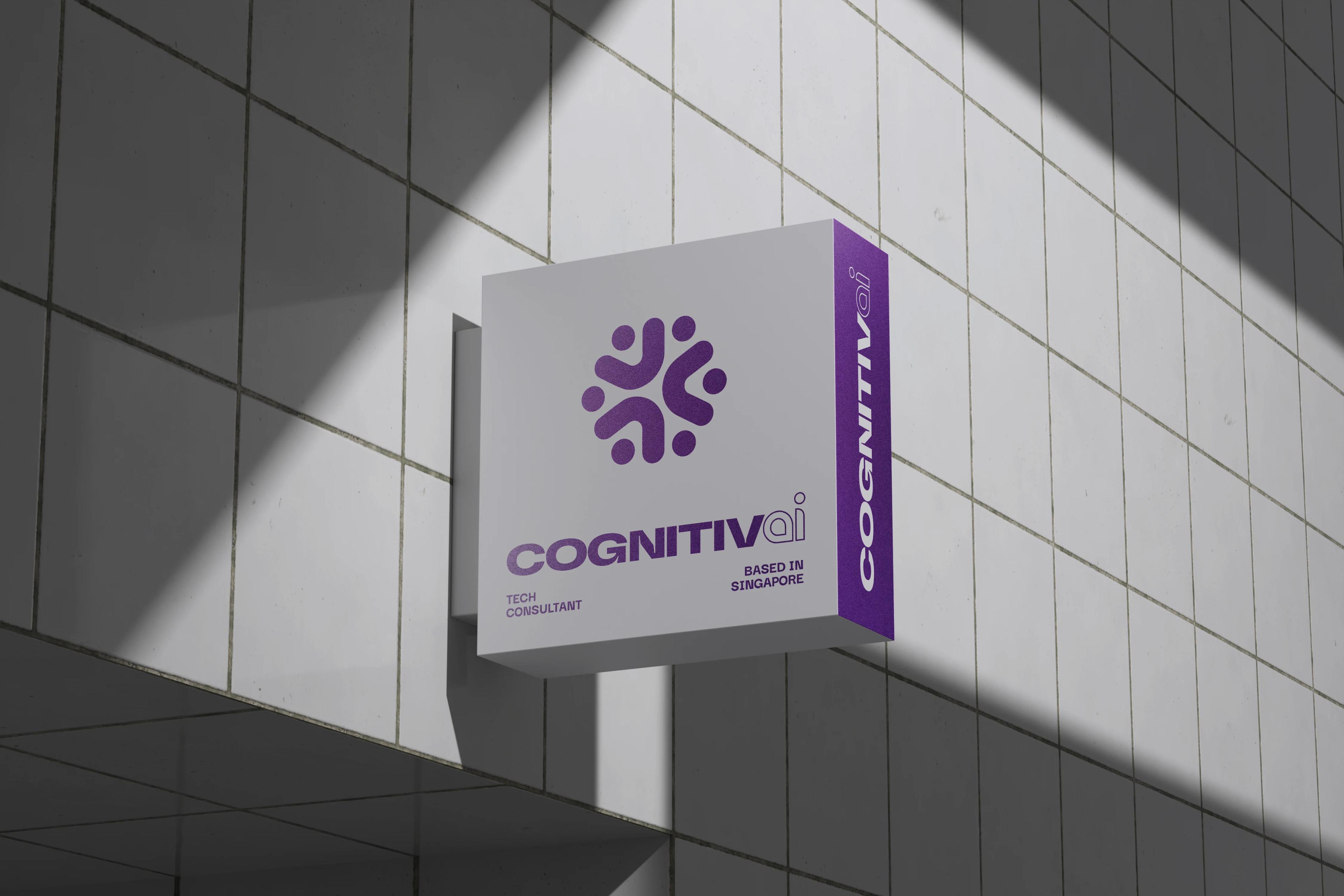 A projecting box sign on a tiled facade reading Cognitiv AI, the purple return edge catching light.